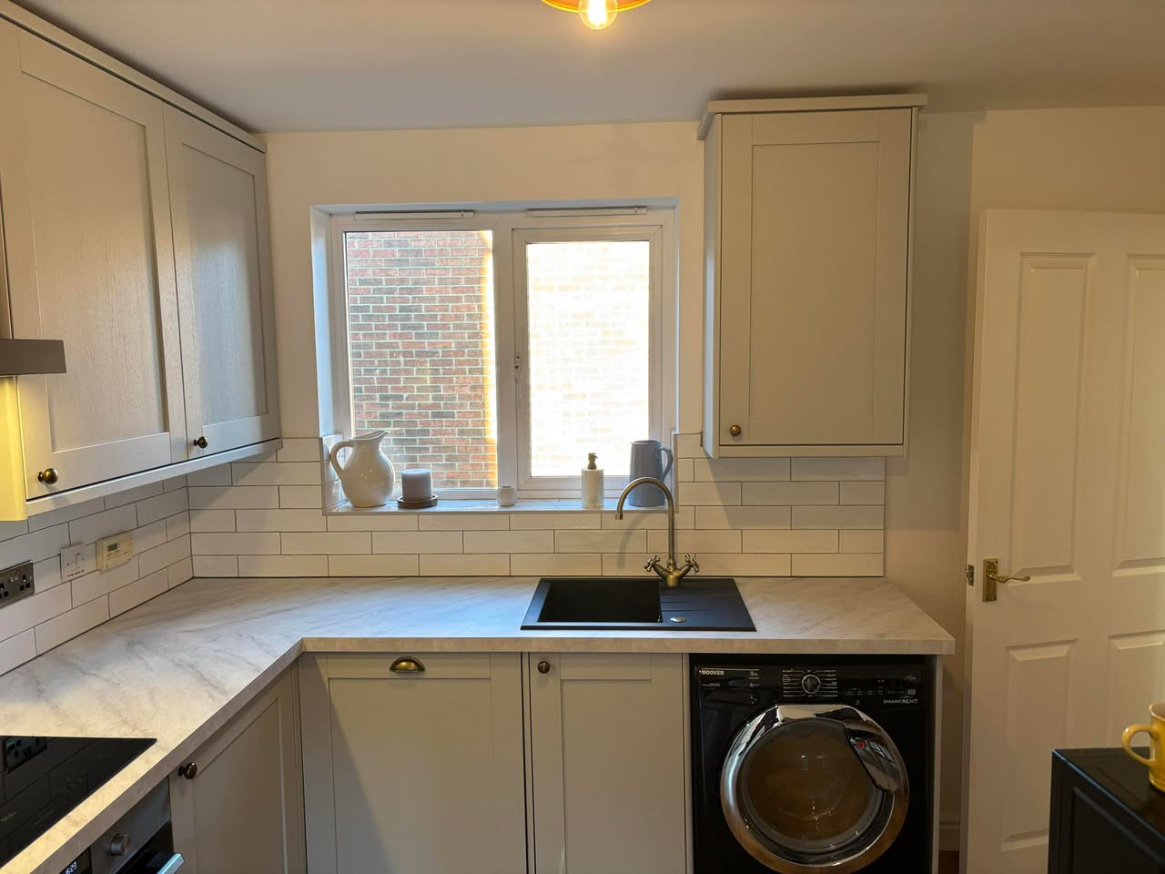 Cream shaker kitchen with marble-effect worktop (2)