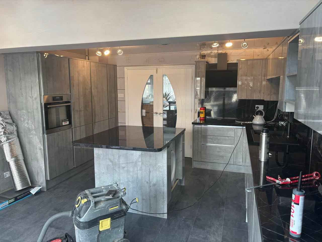 Sage kitchen with marble-effect breakfast bar (3)